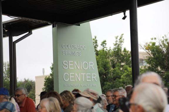 The new sign that reads "Colorado Springs Senior Center - In Honor of Nancy Lewis"