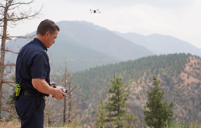 A CSFD firefighter flies a drone.