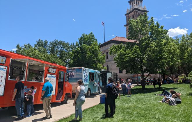 Patrons wait for various food trucks outside of the Colorado Springs Pioneers Museum.