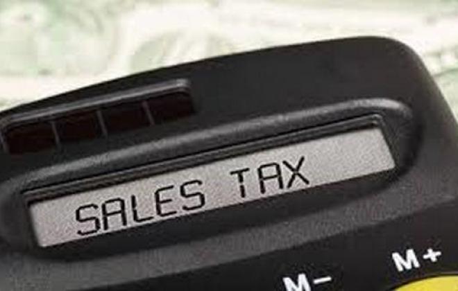 calculator with the words "sales tax" on the display screen